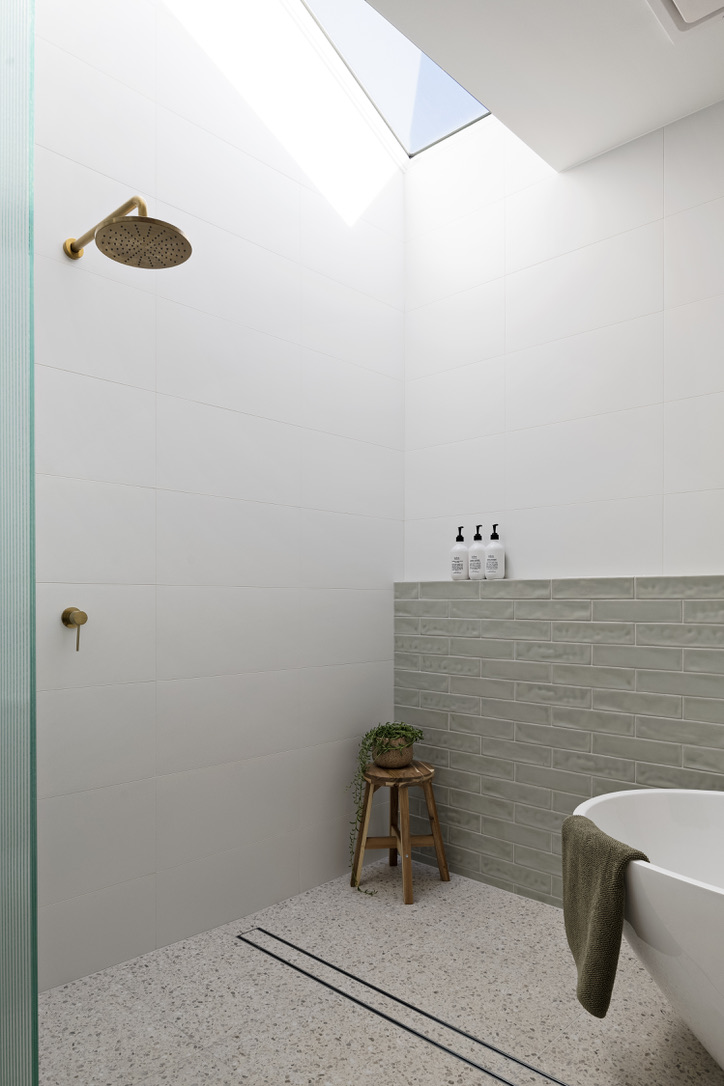 Rossmoyne Street Parkview House Thornbury Main Bathroom Green Tiles Brushed Gold Tapware Skylight Terrazo Floor Bath